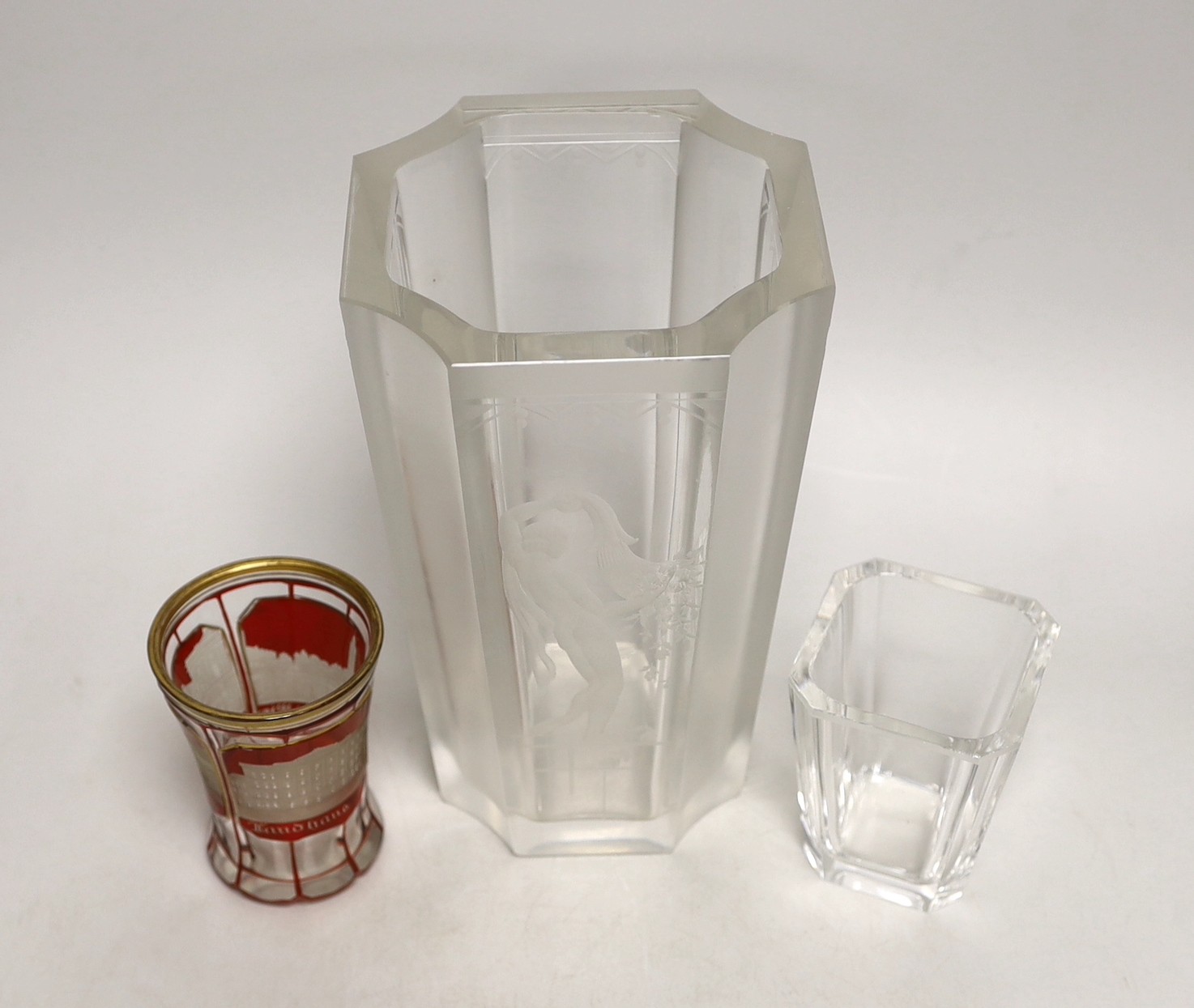 A 19th century Bohemian overlaid tumbler and two engraved vases. Tallest 21cm
